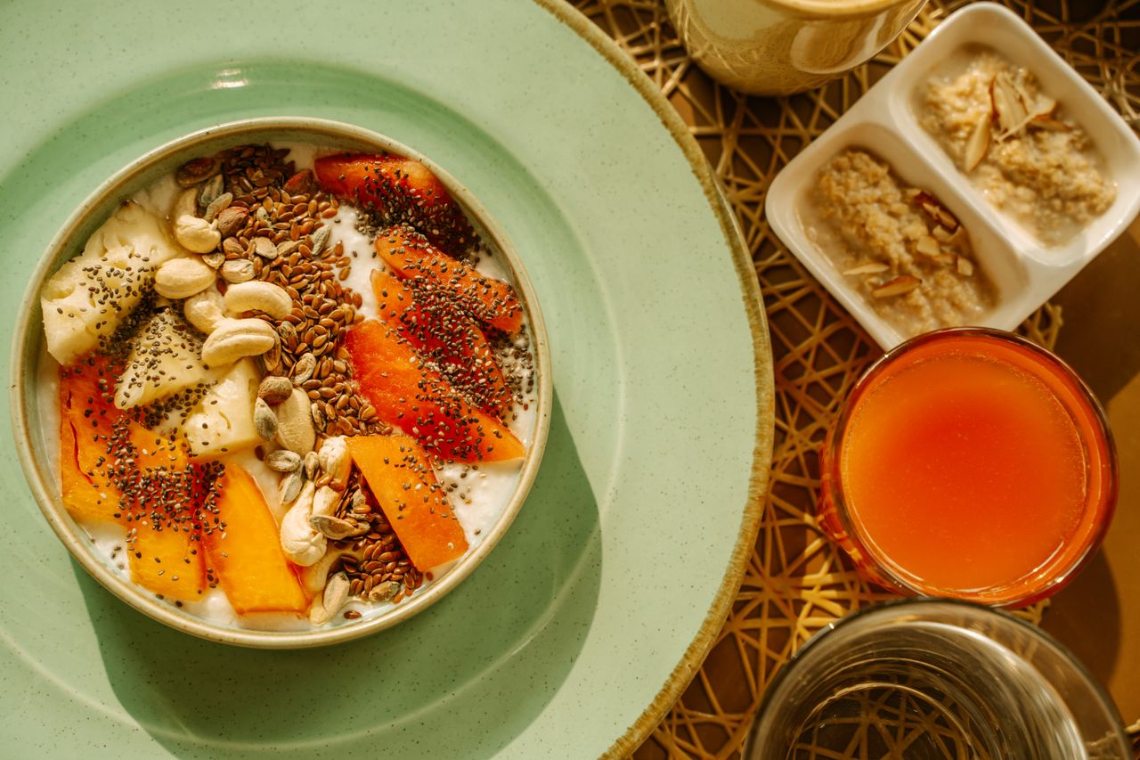 home-hero A vibrant breakfast bowl with yogurt, fruits, and seeds, perfect for a healthy morning start.